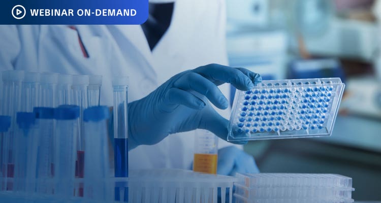 Webinar On-Demand - Photo of a researcher in a lab holding a test tube tray.