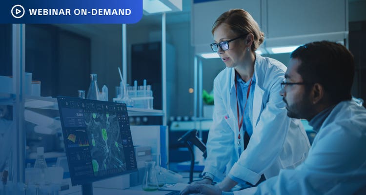 Webinar On-Demand. Photo of two researchers in a lab analyzing cancer cell data on a computer display.