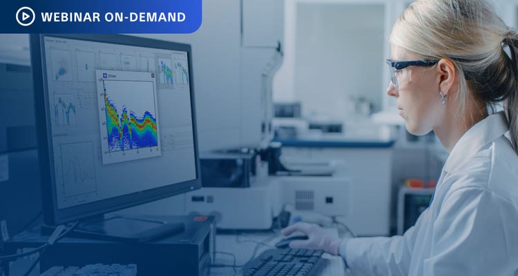 Webinar On-Demand. Researcher in lab viewing spectral data on a computer display.
