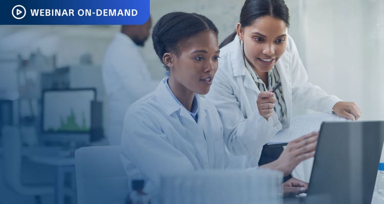 Webinar On-Demand - Two researchers working in a lab looking at a computer display.