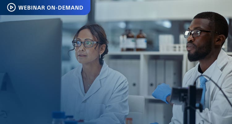 Webinar On-Demand: Photo of two researchers working in a lab looking at a computer display.