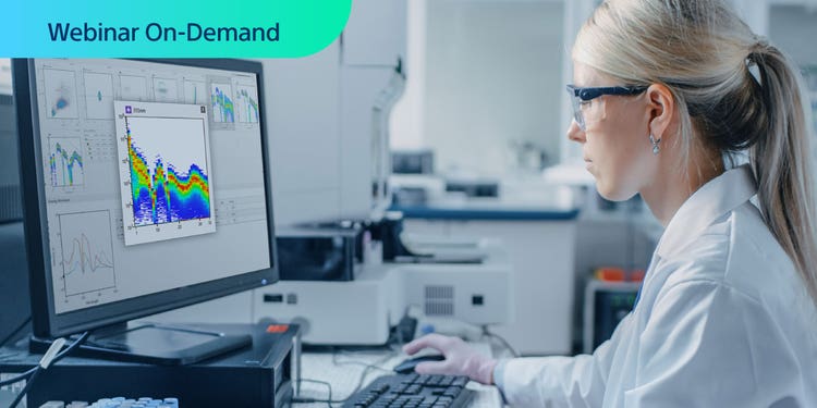Webinar On-Demand. Researcher in lab viewing spectral data on a computer display.