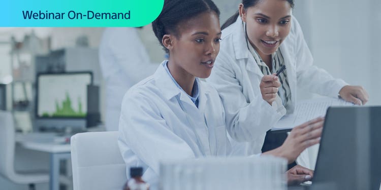 Webinar On-Demand - Two researchers working in a lab looking at a computer display.