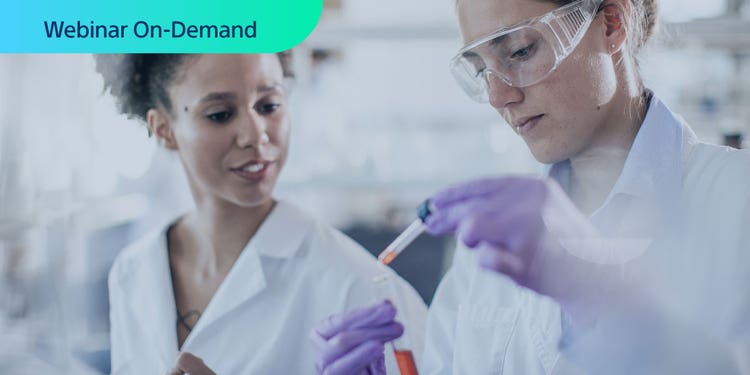 Webinar On-Demand. Photo of two researchers working in a lab setting, with one using a filling a pipet.
