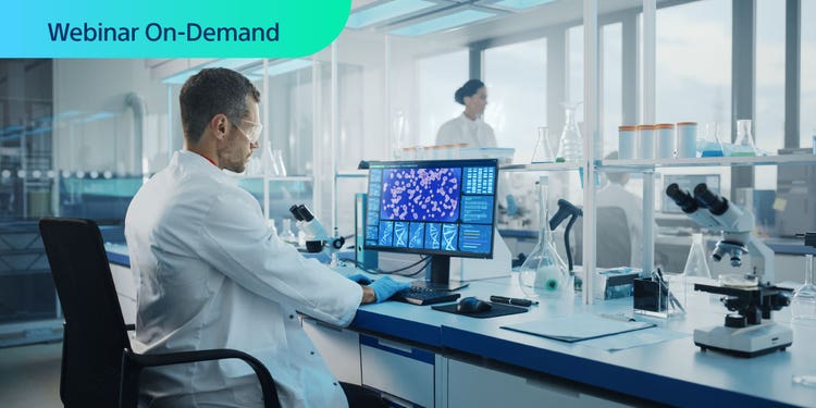 Webinar On-Demans. Researchwed in a lab at a workstation with mRNA data.