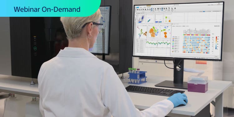 Webnar On-Demand. Photo of researcher from behind, in a lab working with a ID7000 cell analyzer and viewing a computer display with associated flow cytometry data.