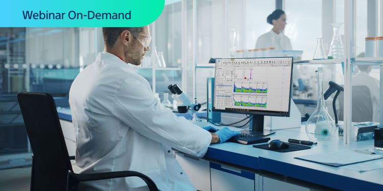 Webinar On-Demand. Photo of lab tech at computer with spectral data in computer screen.