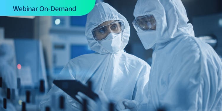 Webinar On-Demand. Two cell therapy manufacturing workers looking at a tablet screen.