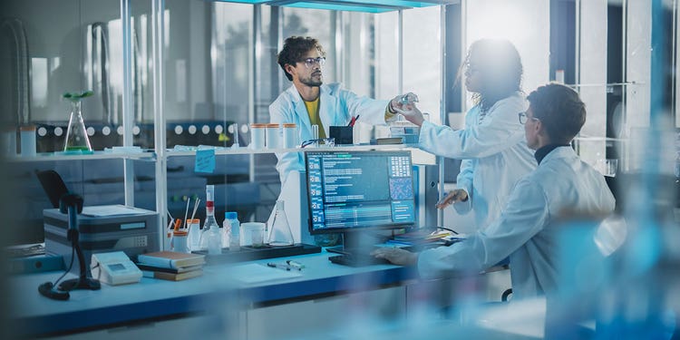Photo of researchers working in a modern laboratory.