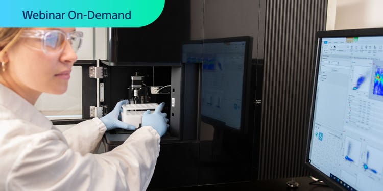 Webinar On-Demand. Photo of researcher using an ID7000 Spectral Cell Analyzer and viewing associated data on computer display.