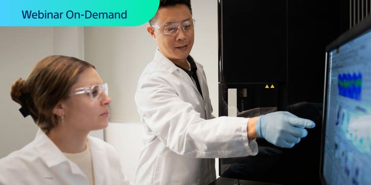 Webinar On-Demand. Photo of two researchers discussing data on a computer display next to an ID7000 spectral cell analyzer.