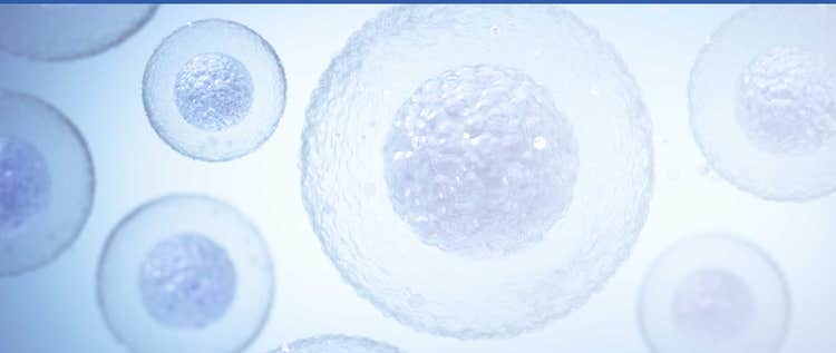 Close-up view of blue cellular structures floating in a bright blue background
