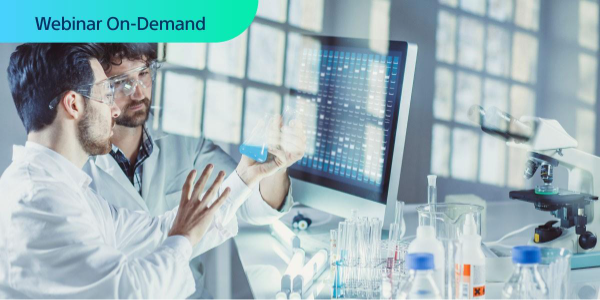 Webinar On-Demand. Two male researchers in a lab having a conversation while holding a beaker of blue liquid.
