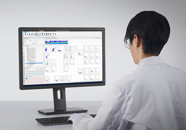Photograph of researcher in lab coat at a screen using ID7000 software