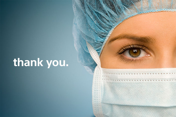 Photo of masked healthcare worker with text thank you superimmposed.